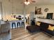 Open-concept living space boasting new floors, modern furnishings, and stylish accents at 1316 Long Shore Dr, Indianapolis, IN 46217