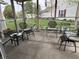 Relaxing screened porch overlooking well-manicured lawn at 1316 Long Shore Dr, Indianapolis, IN 46217