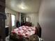 Bedroom with a queen bed, dresser, closet, and natural light from the window at 1337 N Olney St, Indianapolis, IN 46201