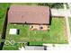 Aerial view of a fenced backyard with a deck, outdoor dining and well-maintained landscaping at 1355 Ash Ct, Martinsville, IN 46151