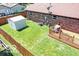 Aerial view of home backyard featuring a deck, shed, and privacy fence at 1355 Ash Ct, Martinsville, IN 46151