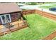 A beautiful yard with a spacious deck, table, and chairs that has a fenced yard at 1355 Ash Ct, Martinsville, IN 46151