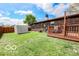 Green backyard featuring a shed and privacy fence at 1355 Ash Ct, Martinsville, IN 46151