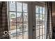 View from inside home, highlighting the fenced backyard with a patio set at 1355 Ash Ct, Martinsville, IN 46151