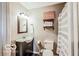 Bathroom featuring a vanity, toilet, patterned shower curtain, and modern lighting at 1355 Ash Ct, Martinsville, IN 46151