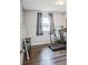 Bedroom featuring laminate wood floors and a window with curtains at 1355 Ash Ct, Martinsville, IN 46151