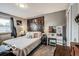 Cozy bedroom boasts a queen bed, decor, and a vanity, with hardwood flooring at 1355 Ash Ct, Martinsville, IN 46151