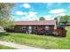 Charming brick home with a well-maintained lawn, landscaping, and cozy curb appeal at 1355 Ash Ct, Martinsville, IN 46151