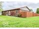 Single story home with a fenced yard and a well-maintained lawn at 1355 Ash Ct, Martinsville, IN 46151
