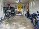 Well-lit garage with storage shelves and a motorcycle parked inside at 1355 Ash Ct, Martinsville, IN 46151