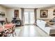 Open-concept living room featuring hardwood floors, neutral walls, and French doors to the outside at 1355 Ash Ct, Martinsville, IN 46151