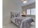 Cozy bedroom features a ceiling fan and a window with white shutters at 1395 Heron Ridge Blvd, Greenwood, IN 46143