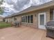 Wooden deck with table, grill, and views of the landscaped backyard at 1395 Heron Ridge Blvd, Greenwood, IN 46143