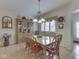 Charming dining room showcasing a wood table with seating for six and natural light from the window at 1395 Heron Ridge Blvd, Greenwood, IN 46143