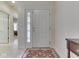 Bright foyer featuring tiled flooring, decorative front door, and access to other rooms at 1395 Heron Ridge Blvd, Greenwood, IN 46143