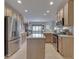 Well-equipped kitchen with stainless steel appliances, island, granite countertops, and access to the dining room at 1395 Heron Ridge Blvd, Greenwood, IN 46143