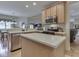 Bright kitchen with granite countertops, stainless steel appliances, and an open view to the dining area at 1395 Heron Ridge Blvd, Greenwood, IN 46143