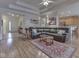 Spacious living area with an open layout, hardwood floors, and access to the kitchen at 1395 Heron Ridge Blvd, Greenwood, IN 46143