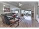 Spacious living room featuring hardwood floors, large windows, and an open layout at 1395 Heron Ridge Blvd, Greenwood, IN 46143