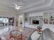Open-concept living room with hardwood floors, custom built-ins, and a comfortable layout at 1395 Heron Ridge Blvd, Greenwood, IN 46143