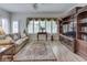 Bright and airy living room with hardwood floors, a large window, and comfortable seating at 1395 Heron Ridge Blvd, Greenwood, IN 46143