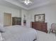 Well-decorated main bedroom showcasing ample space, neutral colors, and an ensuite bathroom at 1395 Heron Ridge Blvd, Greenwood, IN 46143
