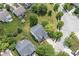 Overhead view of the home's roof and driveway, with lush surrounding trees and landscaping at 15936 Symphony Blvd, Noblesville, IN 46060