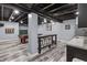 Finished basement including pool table, bar seating, recessed lights, and modern plank flooring at 15936 Symphony Blvd, Noblesville, IN 46060