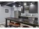 Finished basement wet bar featuring stainless fridge, cabinets, and bar top at 15936 Symphony Blvd, Noblesville, IN 46060