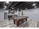 Finished basement featuring a pool table, bar seating, and stainless appliances at 15936 Symphony Blvd, Noblesville, IN 46060