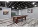 Finished basement featuring a pool table, plank flooring, and exposed ceiling with recessed lighting at 15936 Symphony Blvd, Noblesville, IN 46060