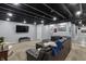 Finished basement living area with sectional sofa, carpet, and television at 15936 Symphony Blvd, Noblesville, IN 46060