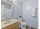 Bathroom features a single sink vanity with hard surface countertop and vinyl plank flooring at 15936 Symphony Blvd, Noblesville, IN 46060