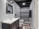 Finished basement bathroom with wood-look flooring and modern vanity sink at 15936 Symphony Blvd, Noblesville, IN 46060
