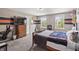 Bedroom featuring a large TV, themed decor, and double windows providing lots of natural light at 15936 Symphony Blvd, Noblesville, IN 46060