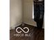 This bedroom features wood-look floors and a window with a dark curtain at 1602 E Minnesota St, Indianapolis, IN 46203