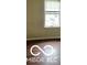 This bedroom features wood-look floors and a window at 1602 E Minnesota St, Indianapolis, IN 46203