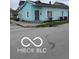 Charming light blue single-story home with simple landscaping and an accessible entrance at 1602 E Minnesota St, Indianapolis, IN 46203