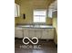 The kitchen features a double sink and white cabinets at 1602 E Minnesota St, Indianapolis, IN 46203