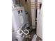 Utility area featuring a modern furnace and a hot water tank, essential for a comfortable home at 1602 E Minnesota St, Indianapolis, IN 46203