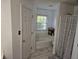 Bright bathroom featuring a tub, shower with patterned curtain and a window for natural light at 1605 Fox Dr, Martinsville, IN 46151