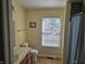 A cozy bathroom with natural light from the window, tile floors and shower/tub combo at 1605 Fox Dr, Martinsville, IN 46151
