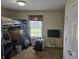 This bedroom features a bunk bed, window, and television, creating a functional and cozy space at 1605 Fox Dr, Martinsville, IN 46151
