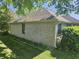 The house is surrounded by lush greenery, emphasizing the home's connection with nature at 1605 Fox Dr, Martinsville, IN 46151