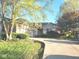 Charming single-story home with a brick exterior, attached garage, and beautiful landscaping on a sunny day at 1605 Fox Dr, Martinsville, IN 46151