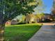 Charming brick home with an attached garage, long driveway, and a beautifully landscaped yard at 1605 Fox Dr, Martinsville, IN 46151