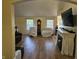 Inviting living room with hardwood floors, fireplace, and large windows at 1605 Fox Dr, Martinsville, IN 46151