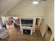 Open-concept living room featuring hardwood floors, fireplace, and open kitchen at 1605 Fox Dr, Martinsville, IN 46151