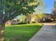 Well-maintained lawn and attractive landscaping leading up to a charming single-story home with an attached garage at 1605 Fox Dr, Martinsville, IN 46151