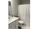 Bathroom featuring sink, toilet, vanity with pulls, and shower with curtain at 17364 Graley Pl, Westfield, IN 46074